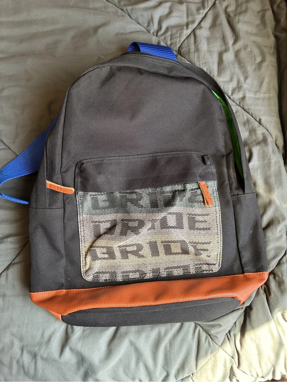 Black Backpack with Orange Trim and Blue Strap